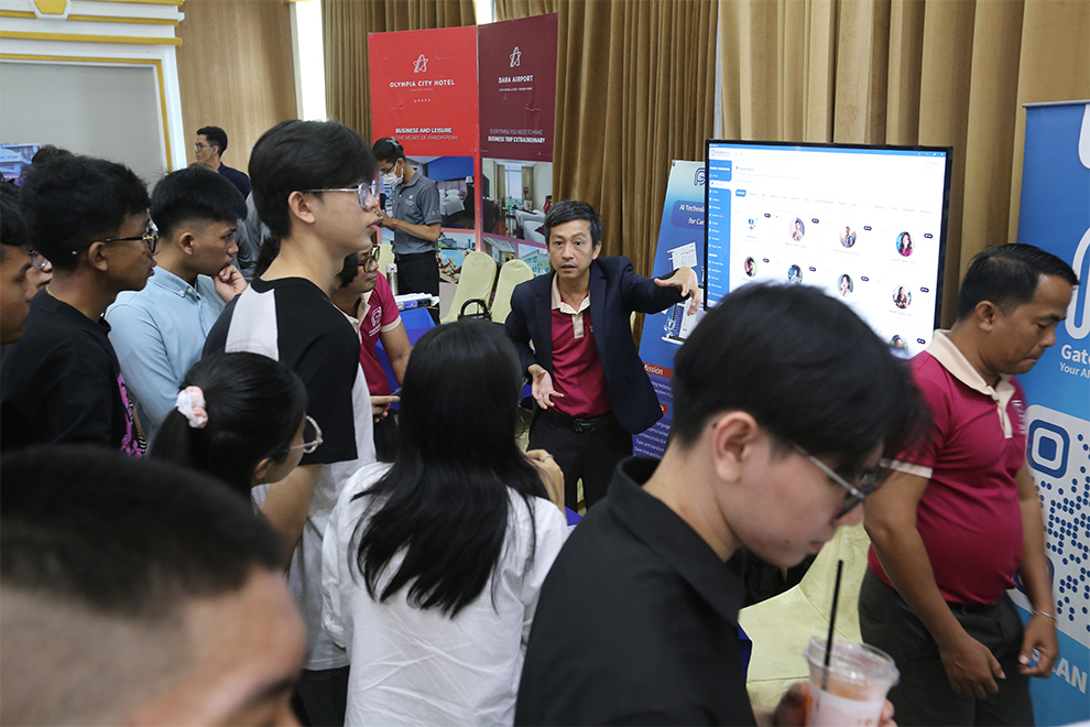 Students examine displays from companies where they may potentially intern one day. Hong Raksmey
