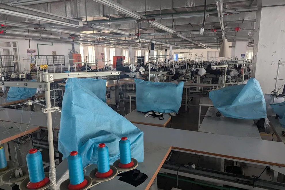 Raft Garments has closed 10 of its 15 lines of sewing machines, covering them with blue plastic. PHOTO: THE STRAITS TIMES