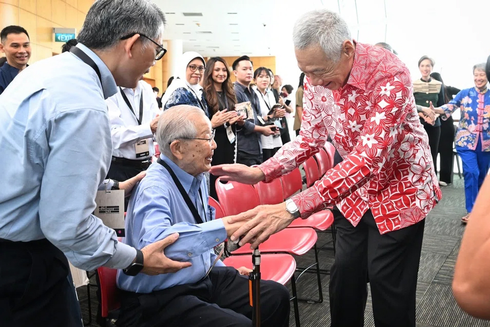 SM Lee Hsien Loong greeting Mr Ong Pang Boon, one of the 10 ministers who signed the Separation Agreement, at the launch of The Albatross File: Inside Separation book and exhibition. PHOTO: THE STRAITS TIMES