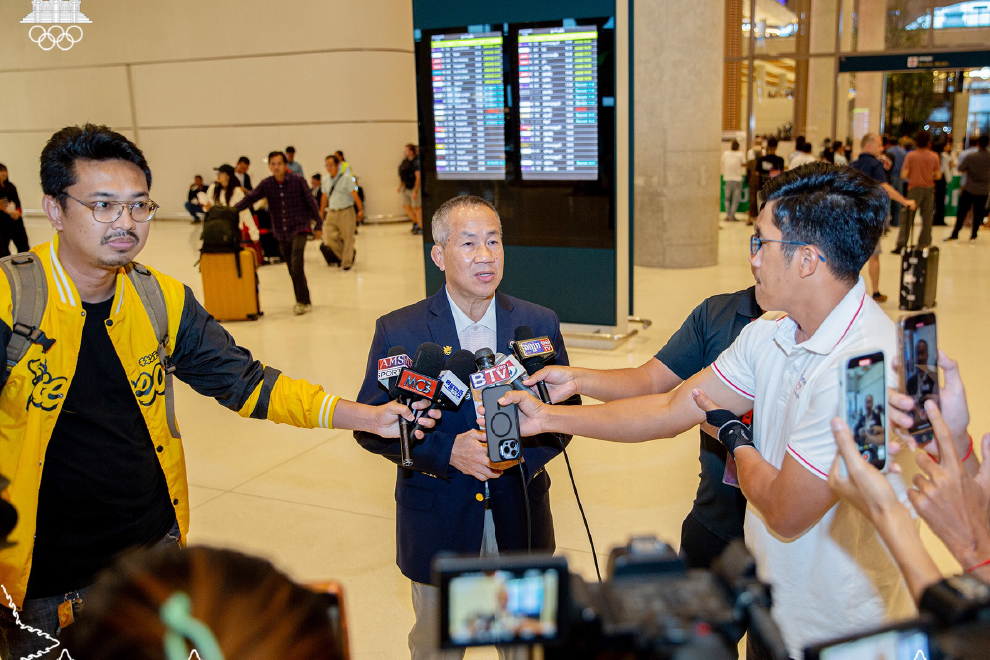 National Olympic Committee of Cambodia (NOCC) secretary-general Vath Chamroeun speaks to the media upon returning to Cambodia at Techo International Airport on December 11. NOCC