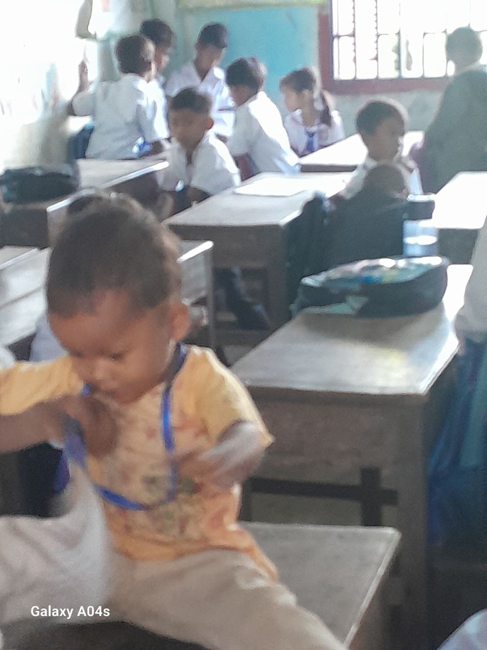 Thea’s two school-age children must care for their two-year-old sibling, even taking him along to school. Supplied