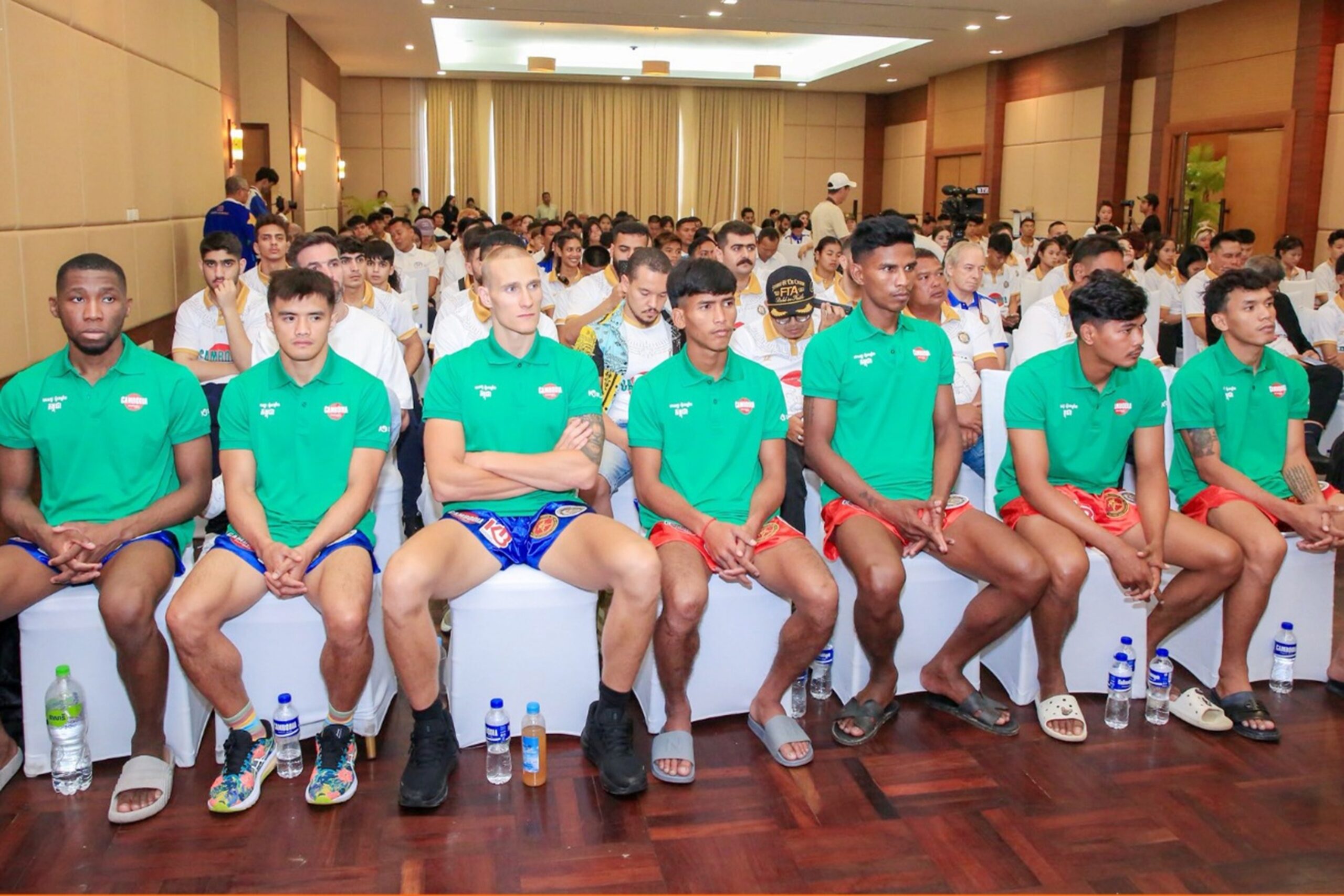 Cambodian and international fighters sit side by side at the press conference ahead of Tuesday night’s world title bouts in Preah Sihanouk. Kun Khmer Federation