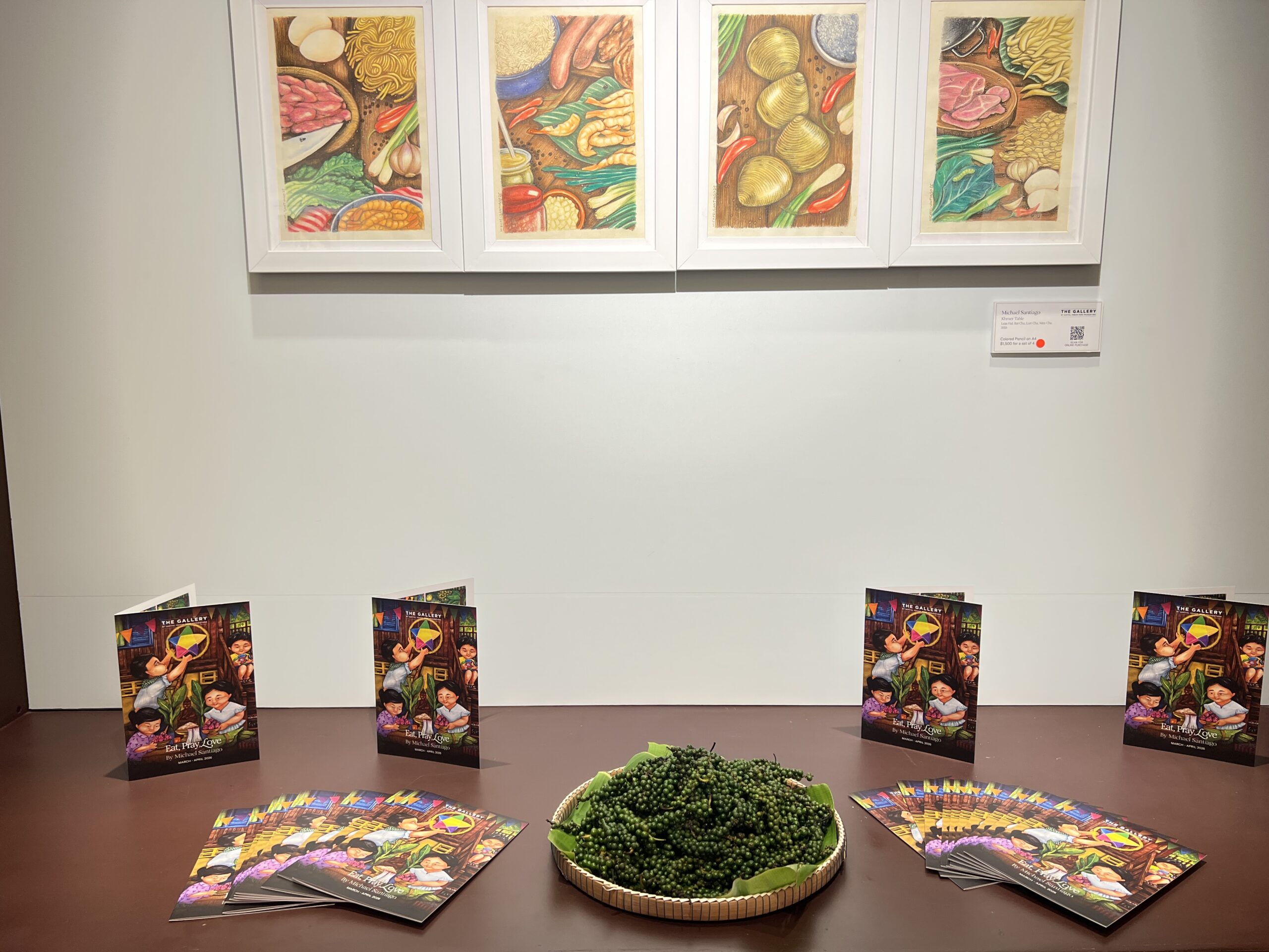 Curated by Don Prostasio, the exhibition features an installation of Khmer culinary ingredients displayed alongside Michael Santiago’s Eat, Pray, Love collection. Supplied