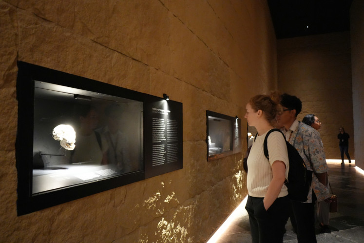 Visitors view the Early History exhibition on Dec. 17, 2025, at the National Museum of Indonesia in Jakarta. The exhibition opened following the return of the Dubois Collection, specimens gathered by Eugène Dubois in the 19th century. PHOTO: INDONESIAN HERITAGE AGENCY/THE JAKARTA POST