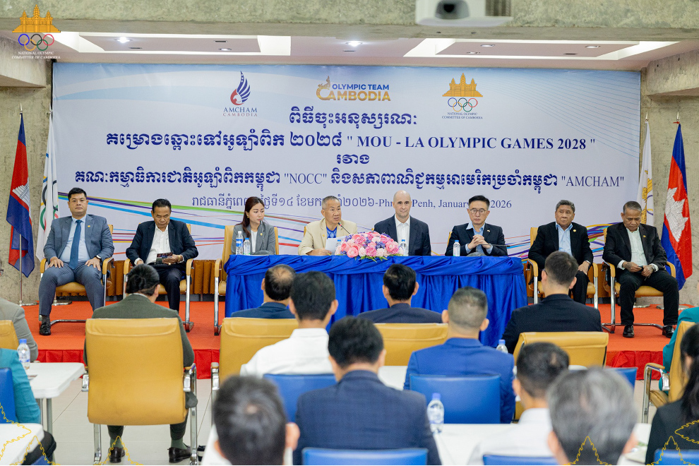 NOCC secretary-general Vath Chamroeun, together with Casey Barnett and Benjamin Chiang, during the MoU signing ceremony at the NOCC headquarters on the morning of January 14. NOCC