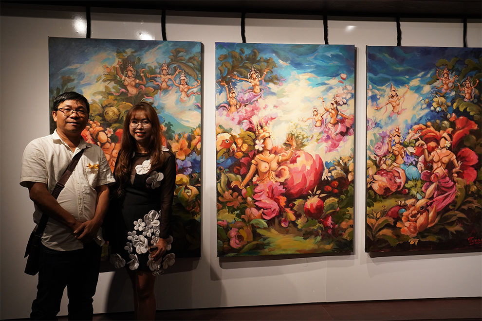 From Siem Reap, artist Rithy Heng (left) contributed three paintings in a single frame, combining flowers, animals and flying apsaras inspired by Angkor Wat. Hong Raksmey