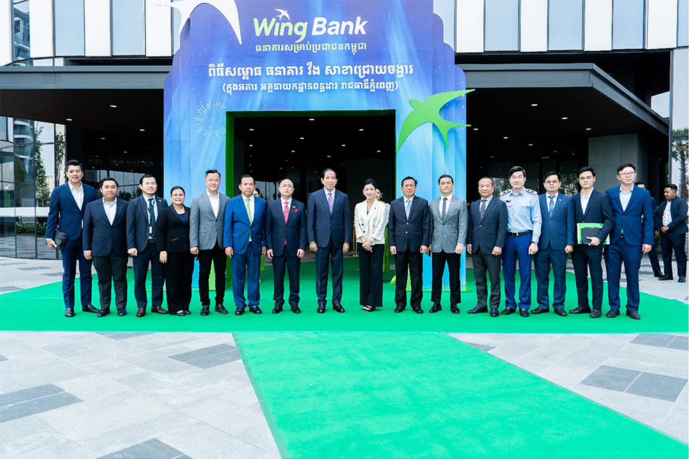 Neak Oknha Kith Meng (centre-right), Chairman of the Board of Directors of Wing Bank and Chairman & CEO of the Royal Group of Companies, and Lok Chumteav Neak Oknha Mao Chamnan (centre-left), Vice‑Chairwoman of the Royal Group of Companies, flank H.E. Kong Vibol, Director General of the General Department of Taxation, during the opening. Supplied