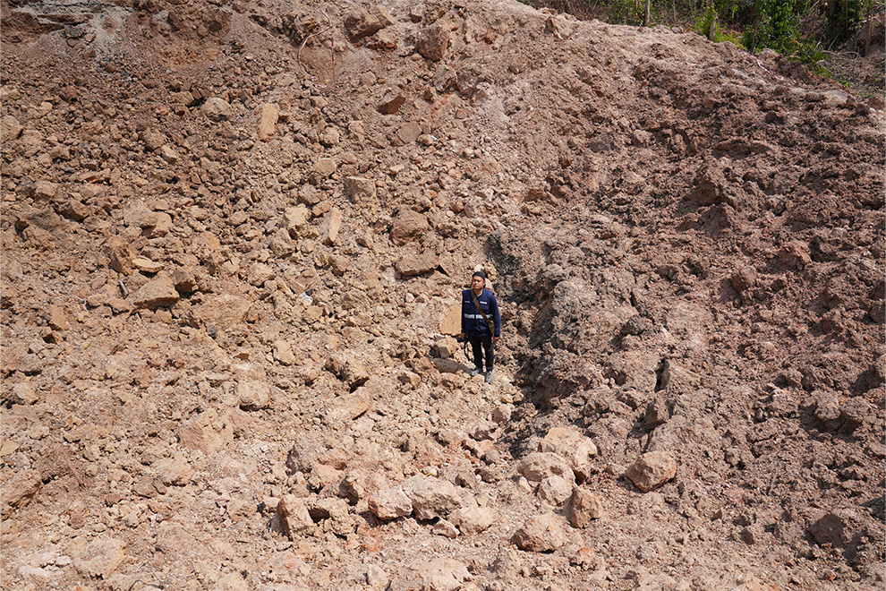 A crater left by an MK-84 bomb measures more than 15 metres across and 10 metres deep. The Thai air strike cut National Road 58 in Banteay Ampil district. Hong Raksmey