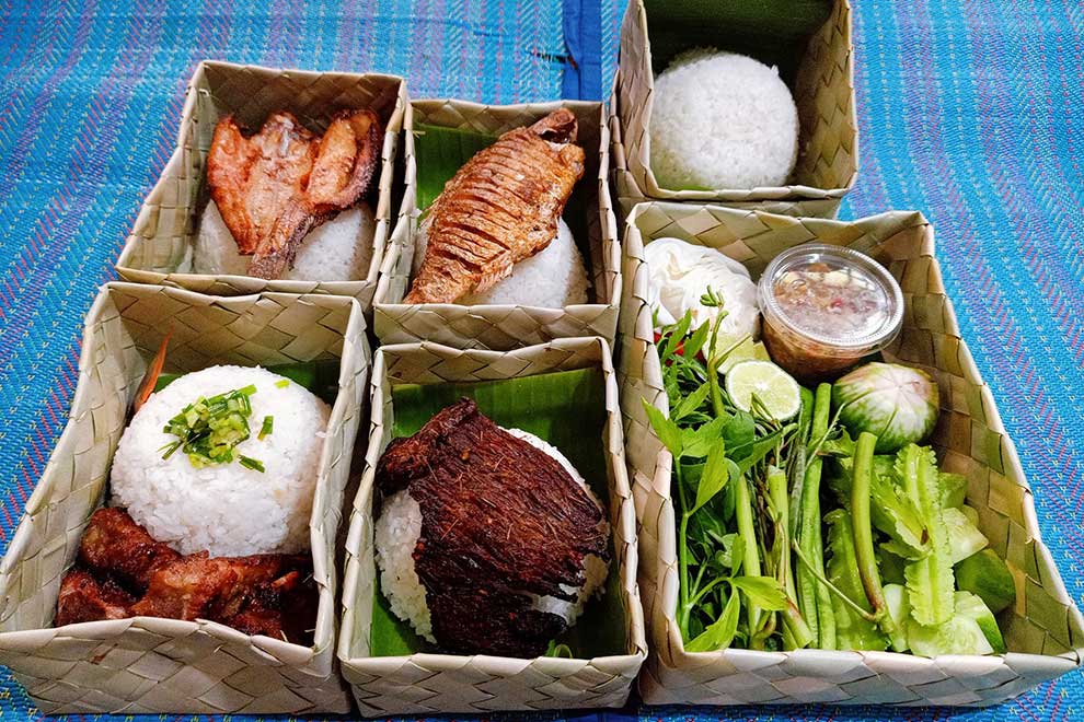 Traditional palm leaf boxes helping to reduce plastic use